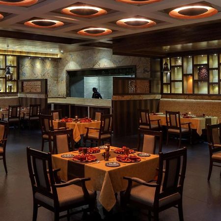 Radisson Blu Plaza Hotel Mysore Exterior foto Interior of a restaurant in India