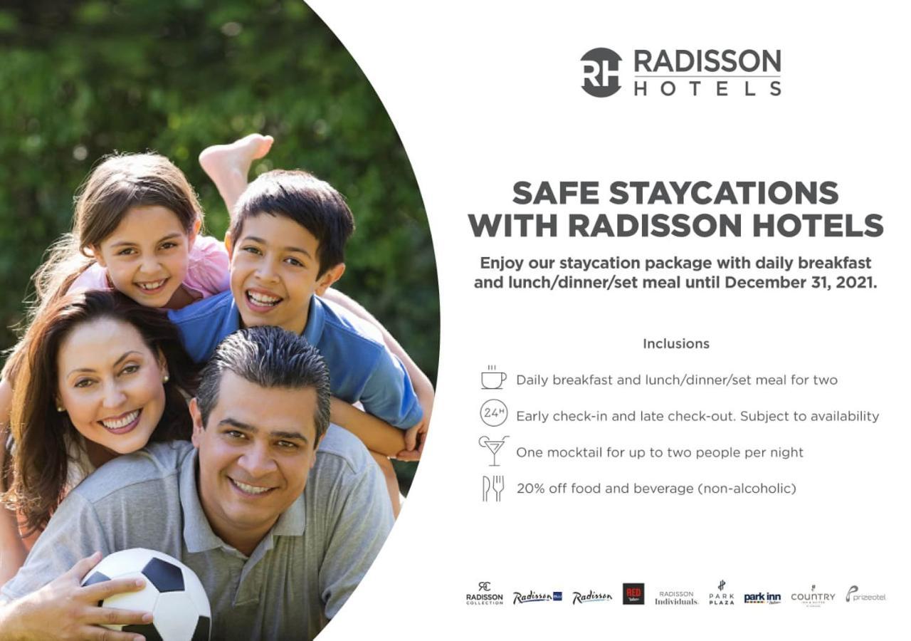 Radisson Blu Plaza Hotel Mysore Exterior foto A Radisson Hotels advertisement