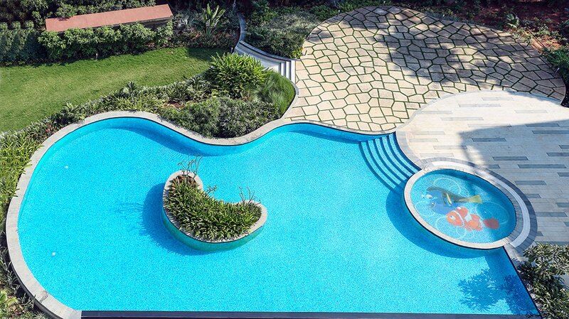 Radisson Blu Plaza Hotel Mysore Exterior foto A swimming pool